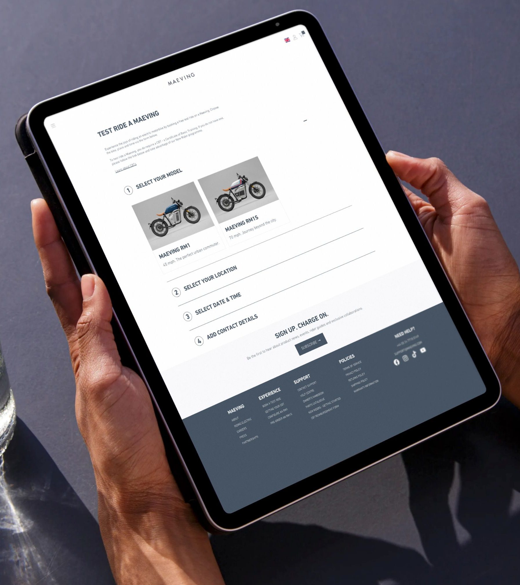 Maveing website on a tablet being held in portrait