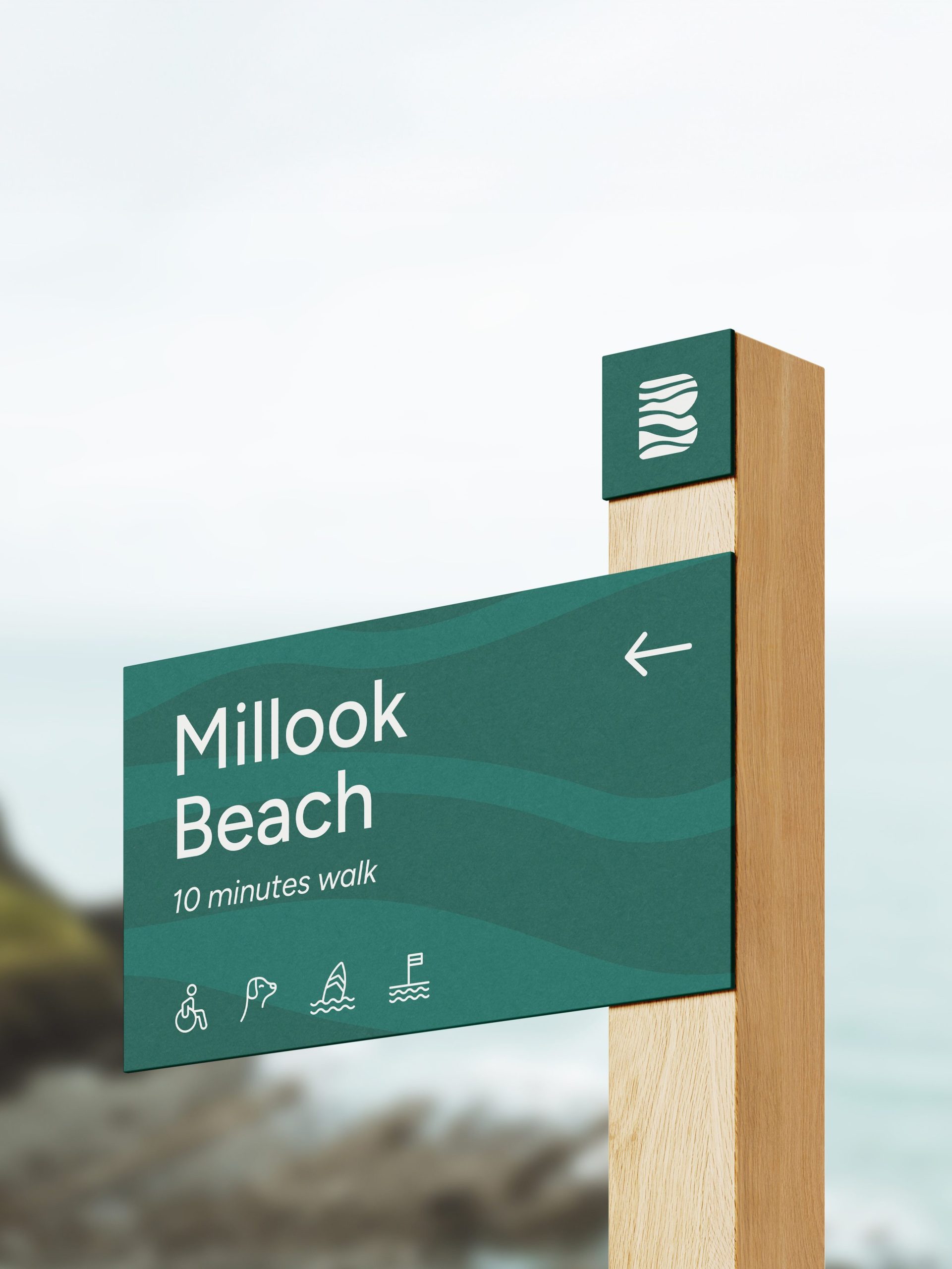 Visit Bude branded wayfinding sign showing directions to Milook Beach