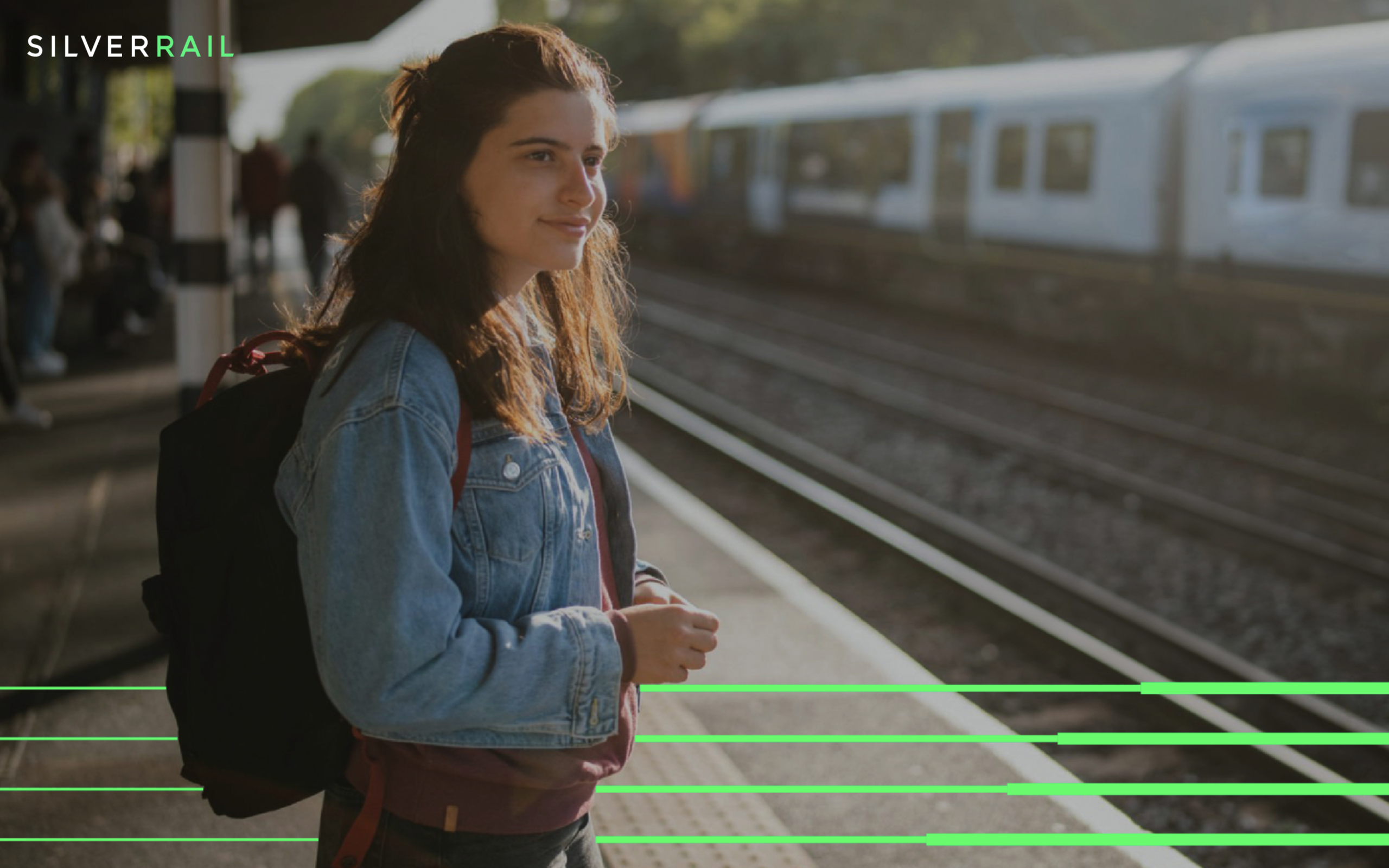 A girl waiting for a train with Silverrail graphic elements incorporated into the image