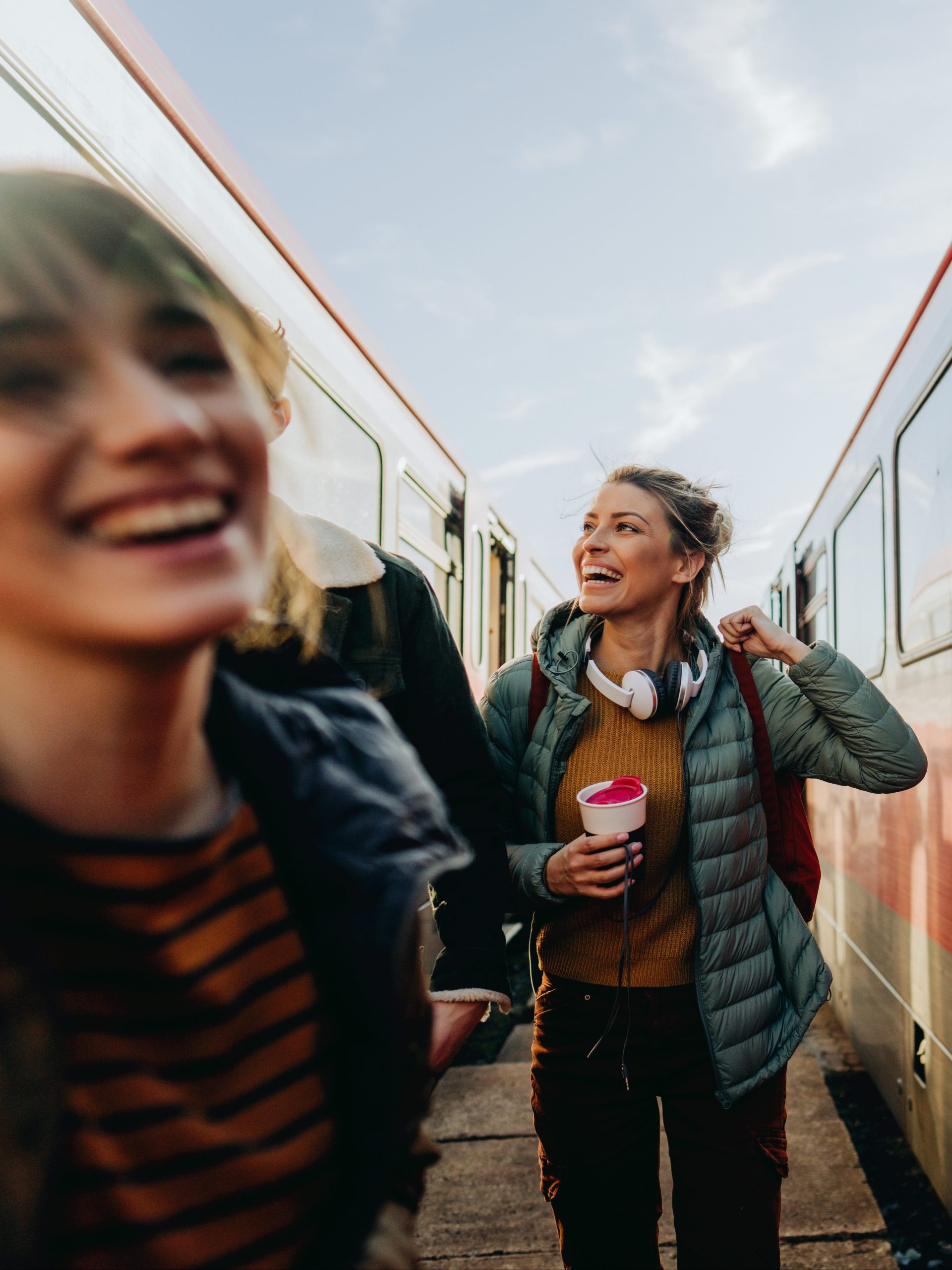 Two young women catching a train